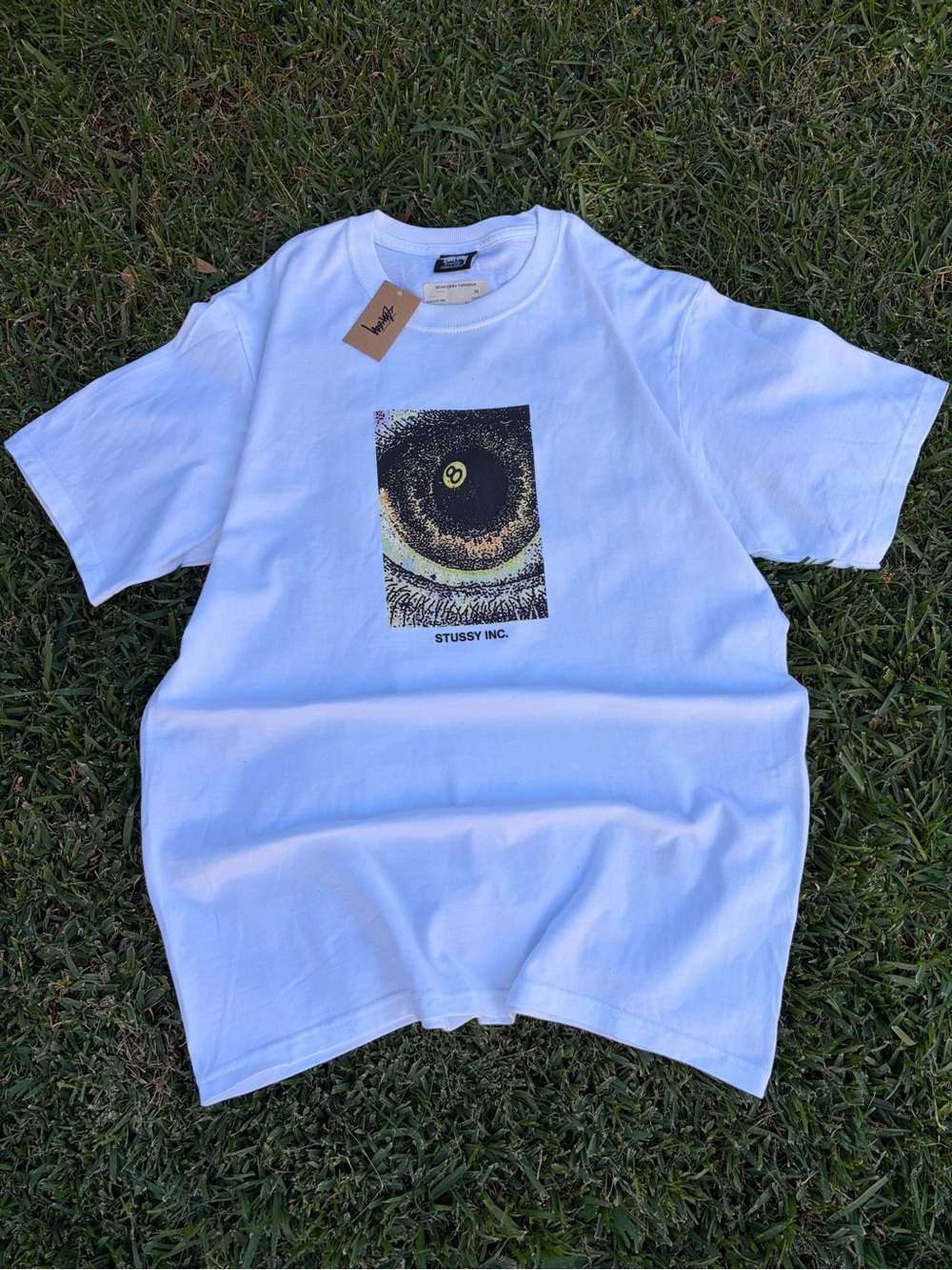Stussy White Tee with Black & Yellow 8 ball Eye Graphic